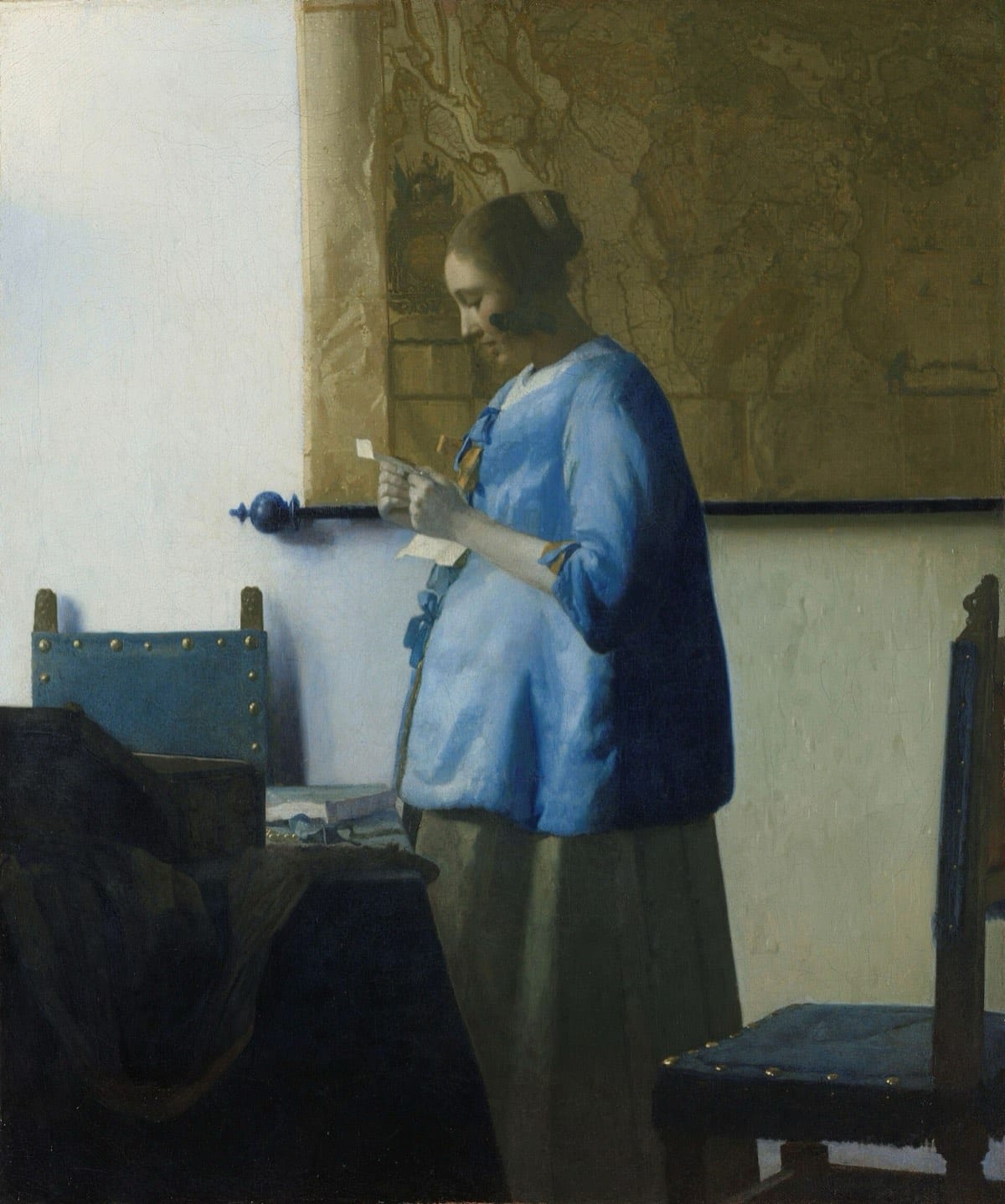 Femme en bleu lisant une lettre, de Johannes Vermeer : une jeune femme absorbée par la lecture d'une lettre